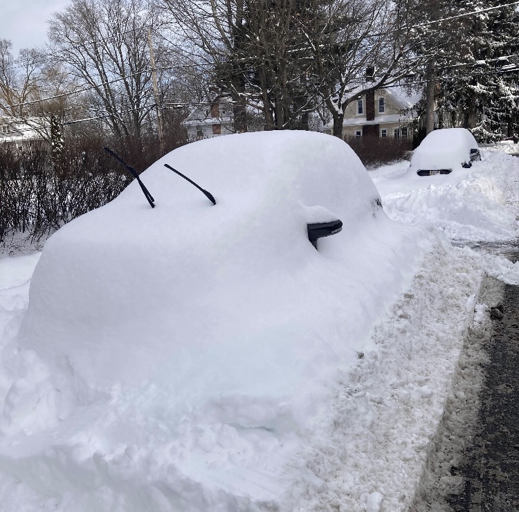A car buried in snow.