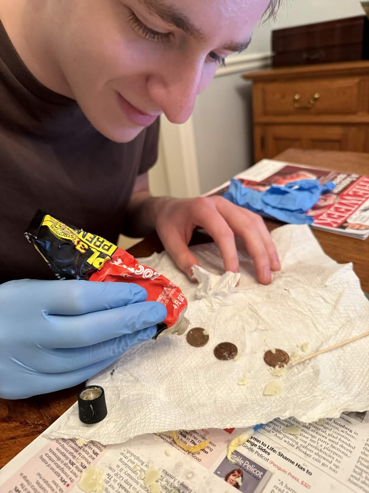 Jordan glueing pennies.